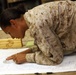 U.S. Navy Sailors work towards their Fleet Marine Force badge with the help of U.S. Marines