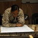 U.S. Navy Sailors work towards their Fleet Marine Force badge with the help of U.S. Marines