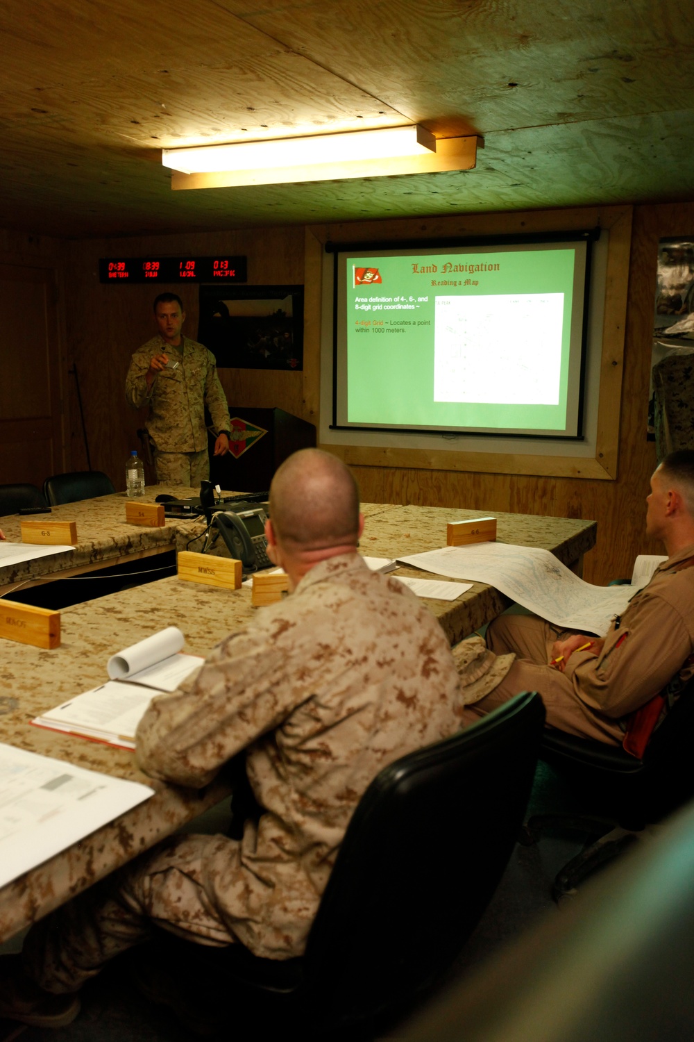 U.S. Navy Sailors work towards their Fleet Marine Force badge with the help of U.S. Marines