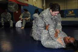 Medic and mechanic spar in Army Combatives