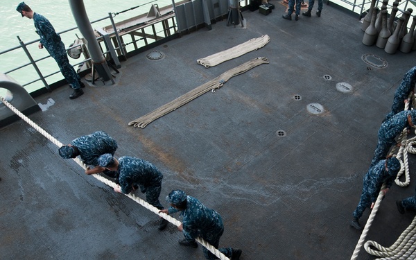 Nimitz sailors heave a line