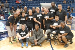 Hershel Walker poses with Sitting Volleyball Team