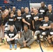 Hershel Walker poses with Sitting Volleyball Team