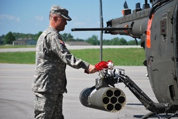 Maj. Mangum christens the Army's new F-model Kiowa Warrior