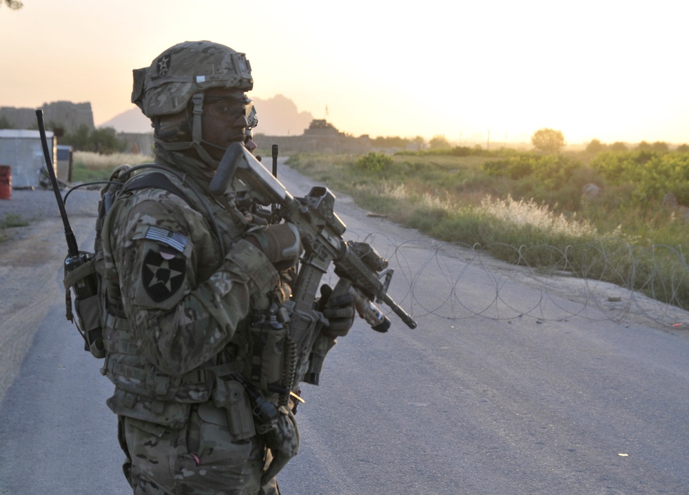 Soldiers conduct traffic checkpoint