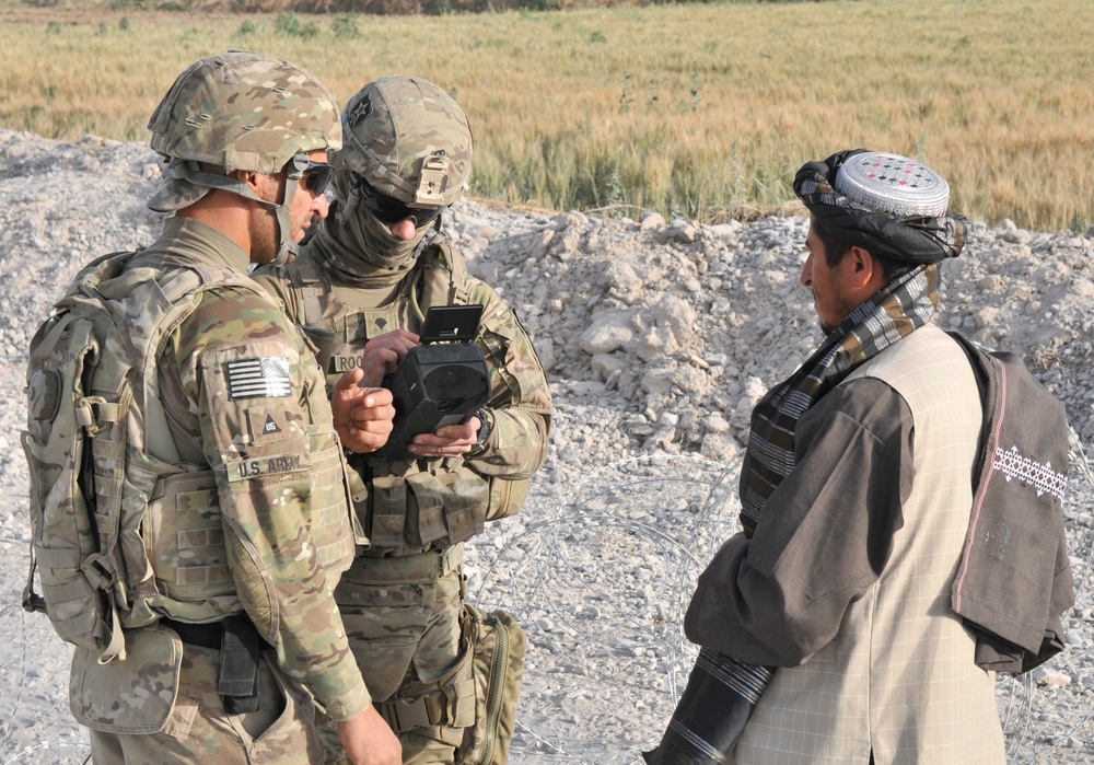 Soldiers conduct traffic checkpoint