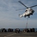 Helicopter delivers cargo aboard USS San Antonio
