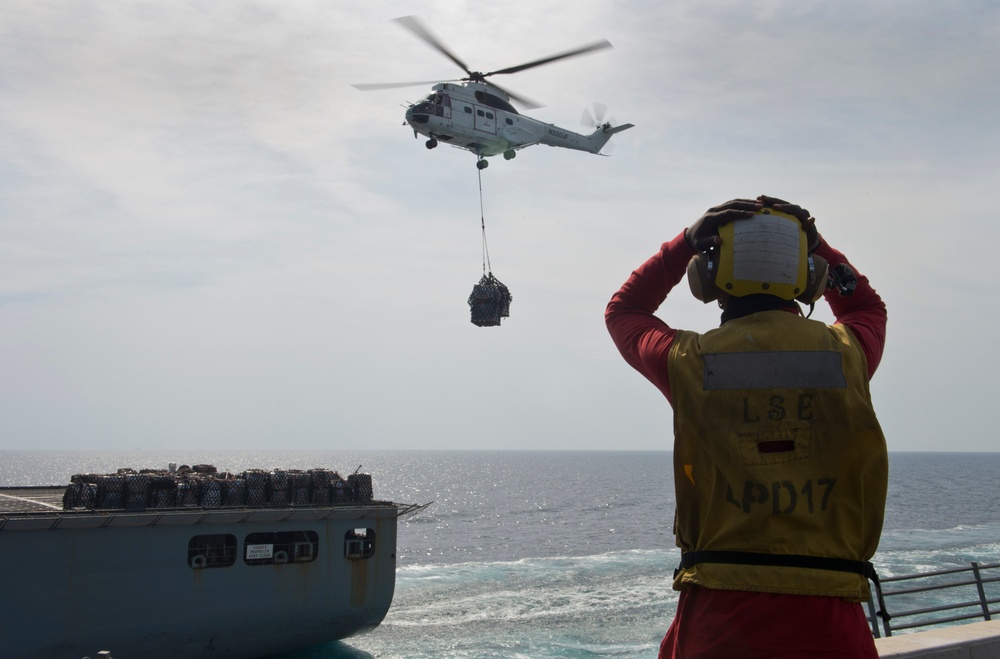 Helicopter delivers cargo aboard USS San Antonio