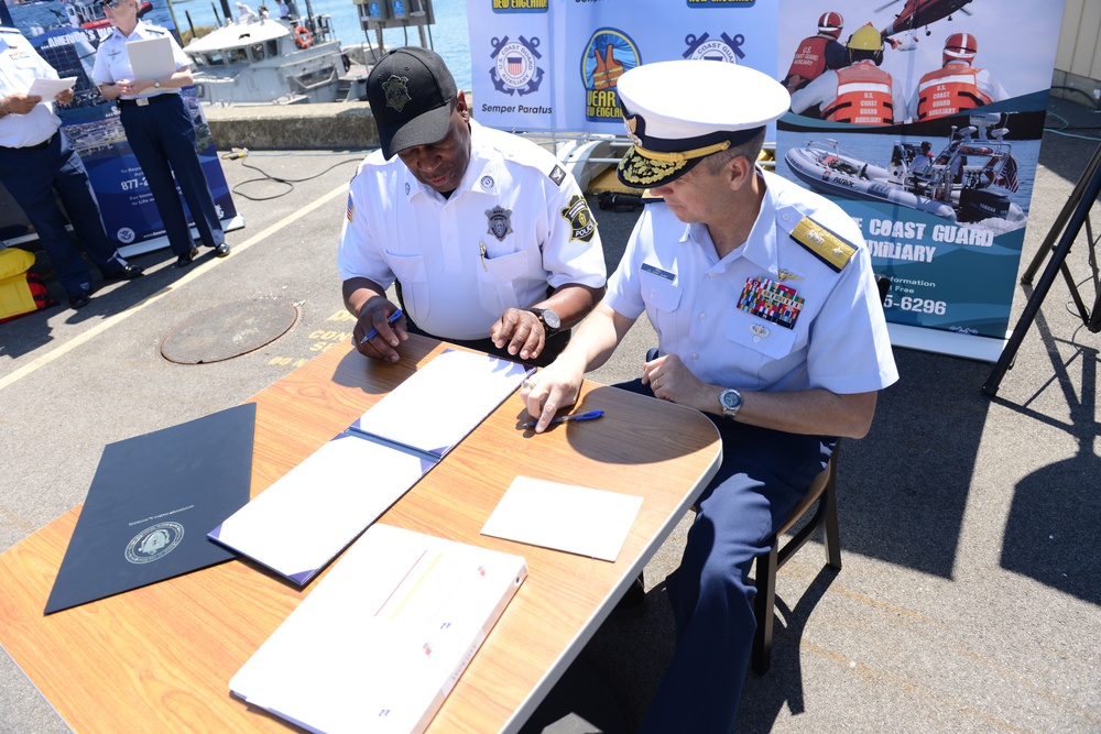 Rear Adm. Dan Abel and Col. Aaron Gross sign the North American Safe Boating Campaign Proclamation