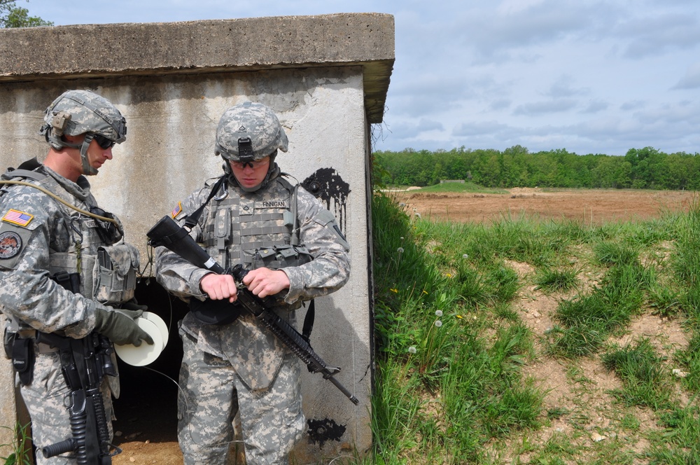 Soldier prepares M81 detonator for cratering charge demolition