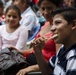 Salvadoran boy receives instruction from a U.S. Soldier on dental hygiene in Metalio, El Salvador