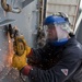 USS Hue City sailor at work