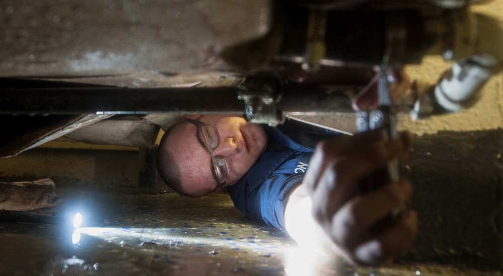 USS Nimitz sailor performs maintenance