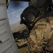 Crew chief scans air space over eastern Afghanistan