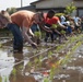 Marines get muddy during rice-planting event