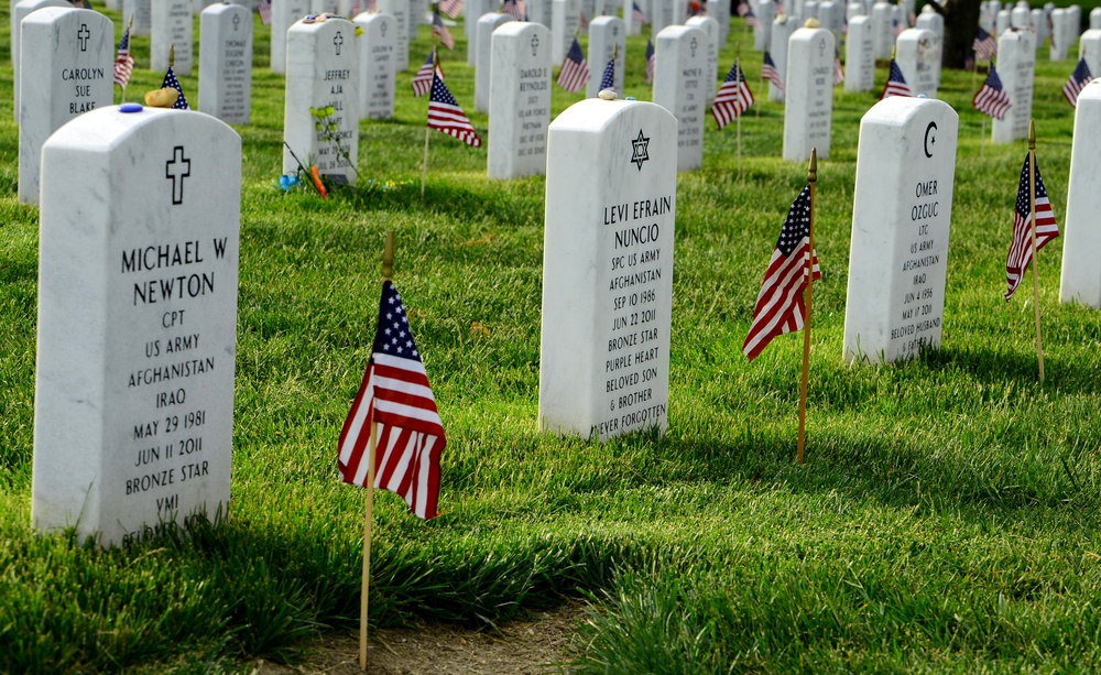 Old Guard soldiers plant flags at Arlington National Cemetery