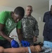 Royal Saint Lucia Police Force detective applies an IV to a training dummy