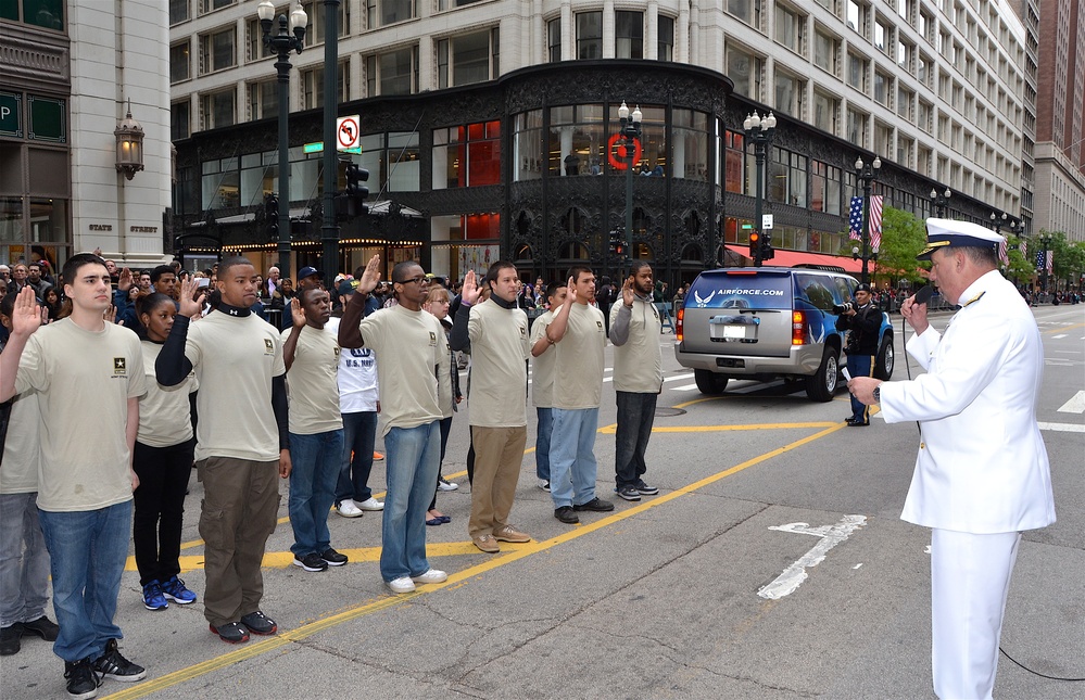 Coast Guard rear admiral administers Oath of Enlistment to recruits during Chicago Memorial Day Parade