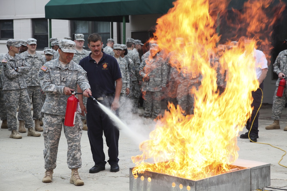 Soldiers rehearse fire extinguisher procedures