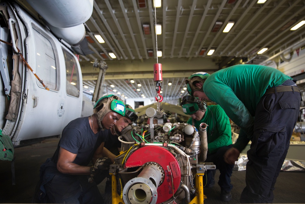 Maintenance on helicopter