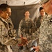 Sergeant major of the Army gives coins of excellence to Expert Field Medical Badge recipients