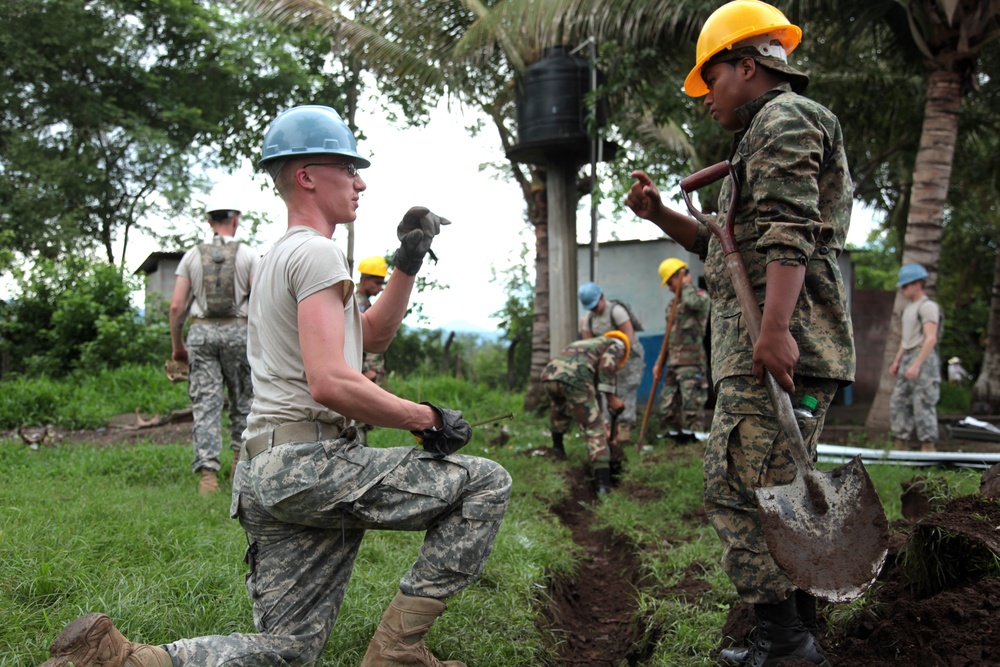 Joint Task Force Jaguar soldiers build latrine for school