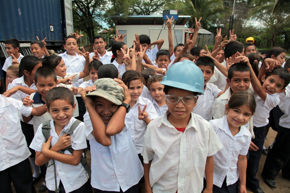 Joint Task Force Jaguar soldiers build latrine for school