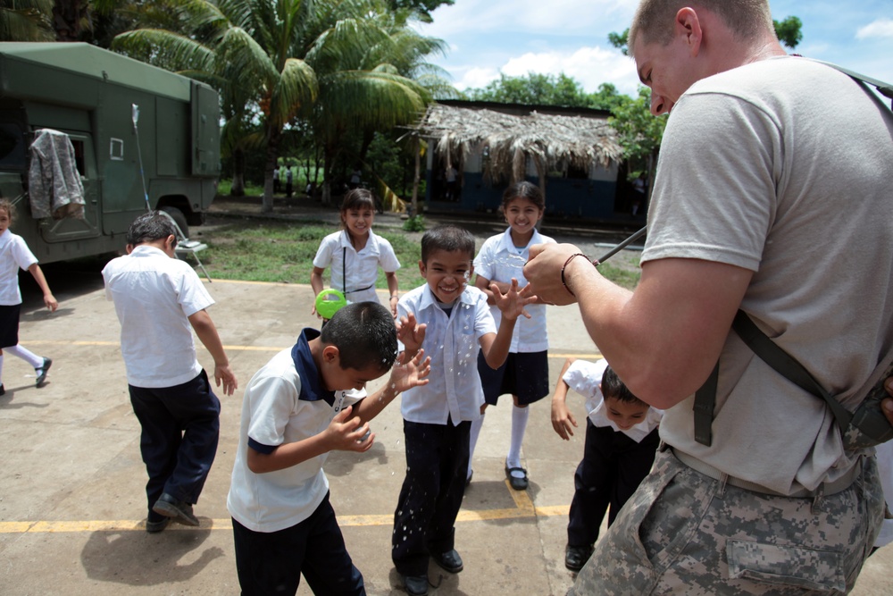 Joint Task Force Jaguar soldiers build latrine for school