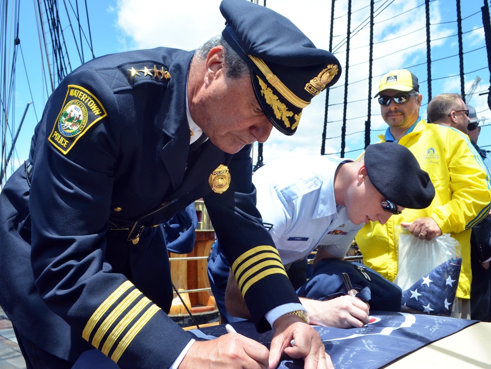 Watertown police chief signs flag