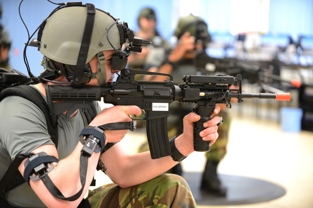 Soldiers from the Netherlands army conduct training in a Dismounted Soldier Training System (DSTS) at the 7th US Army Joint Multinational Training Command (JMTC)