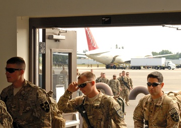 Soldiers return to handshakes, embraces