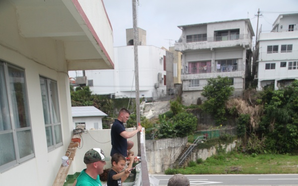 Boy Scout, Marines repaint preschool