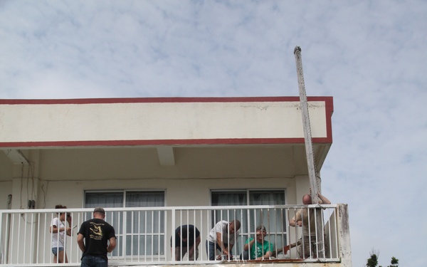 Boy Scout, Marines repaint preschool