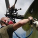 Marines from Marine Aviation Logistics Squadron 29 spray primer paint on a UH-34 from the aviation memorial aboard Marine Corps Air Station New River, May 21. The painting is part of an effort to restore a part of Marine Corps history.