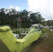 Marines from Marine Aviation Logistics Squadron 29 spray primer paint on a UH-34 from the aviation memorial aboard Marine Corps Air Station New River, May 21. The painting is part of an effort to restore a part of Marine Corps history.