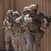 Fire team of Marines with 3rd Battalion, 1st Marines, based out of Camp Pendleton, Calif., stack up to assault the makeshift mosque within the combat village at the Western Barry M. Goldwater Range Yuma, Ariz., June 3.
