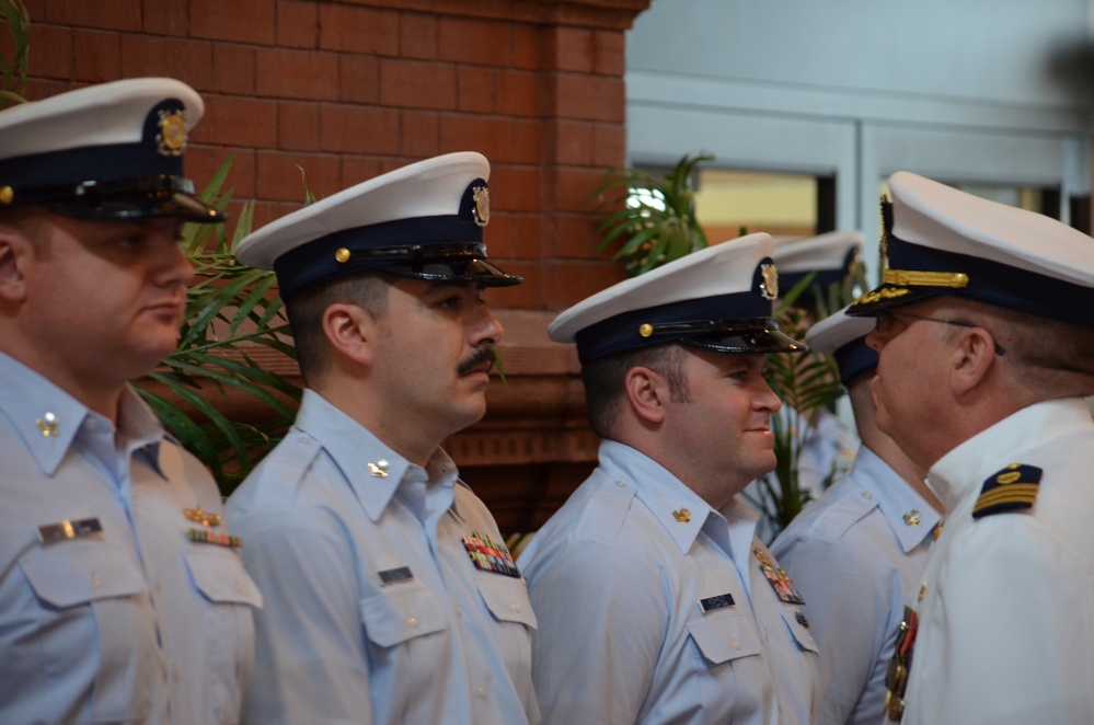 Departing Coast Guard Marine Safety Unit commander holds one final inspection