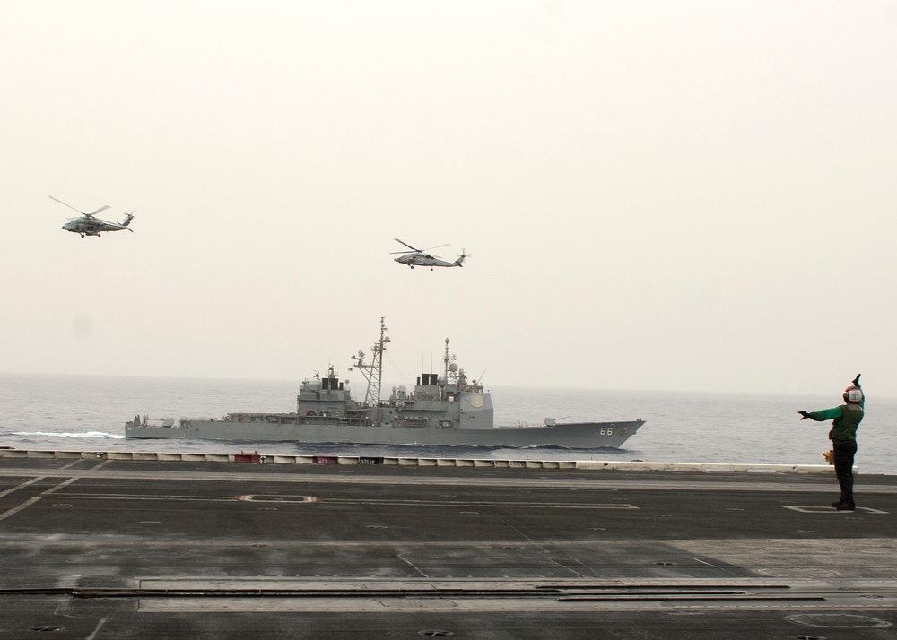 HH-60H Sea Hawk helicopters prepare to land