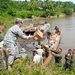 Service member at end of road providing medical care to Panamanians