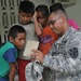 Service member at end of road providing medical care to Panamanians
