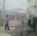 US soldiers assist locals with fire