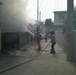 US soldiers assist locals with fire