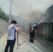 US soldiers assist locals with fire