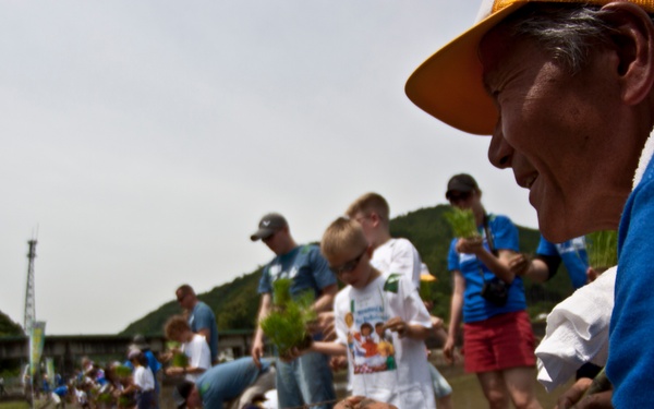 Station residents participate in rice-planting event