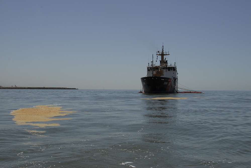 Coast Guard members conduct spilled oil recovery system training