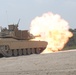 Soldiers from Delta Company, 1-145th Armored Regiment, fire rounds down range from an M1A1 Abrams tank