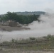 Soldiers from Delta Company, 1-145th Armored Regiment, fire rounds from an M1A1 Abrams tank