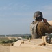 Sgt. 1st Class Daniel Fortney, a platoon sergeant with Charlie Company, 1-145th Armored Regiment, assists in bore sighting the weapon systems of an M1A1 Abrams tank