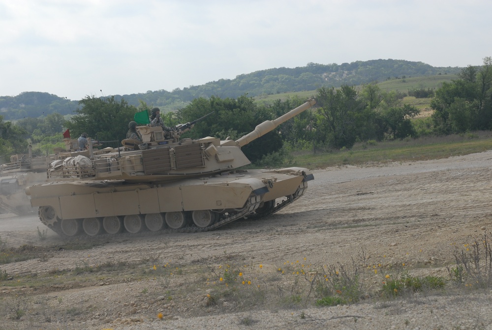 Soldiers from Delta Company, 1-145th Armored Regiment, practice tactical maneuvers with refurbished tanks