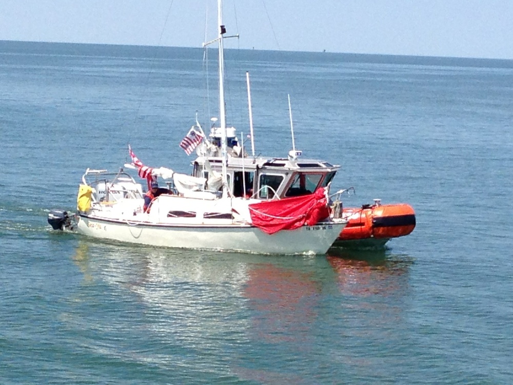 Coast Guard crew assists sailboat taking on water